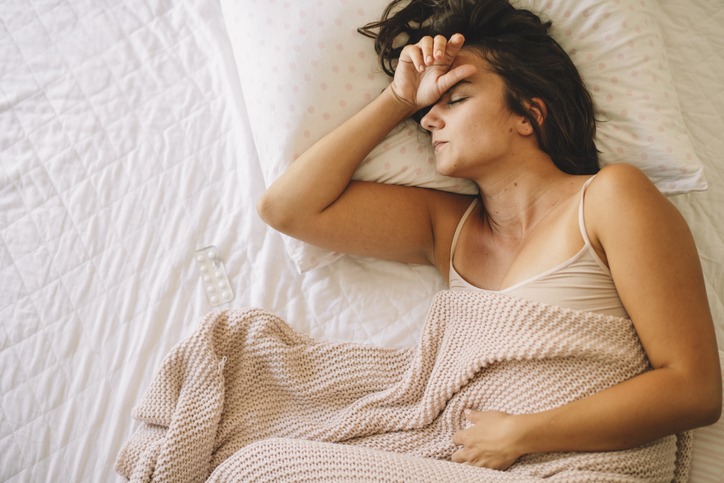 Young upset unhappy woman suffering from menstruation pain,