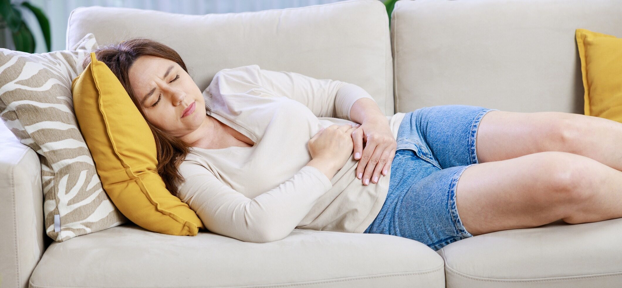 Woman changing her sanitary pad at home